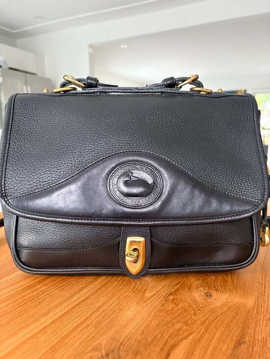 Dooney & Bourke Handbags - Vintage Dooney & Bourke All Weather Leather Carrier Black Purse
